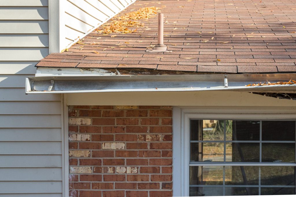 Image of sagging, damaged gutters on a home in need of repair.